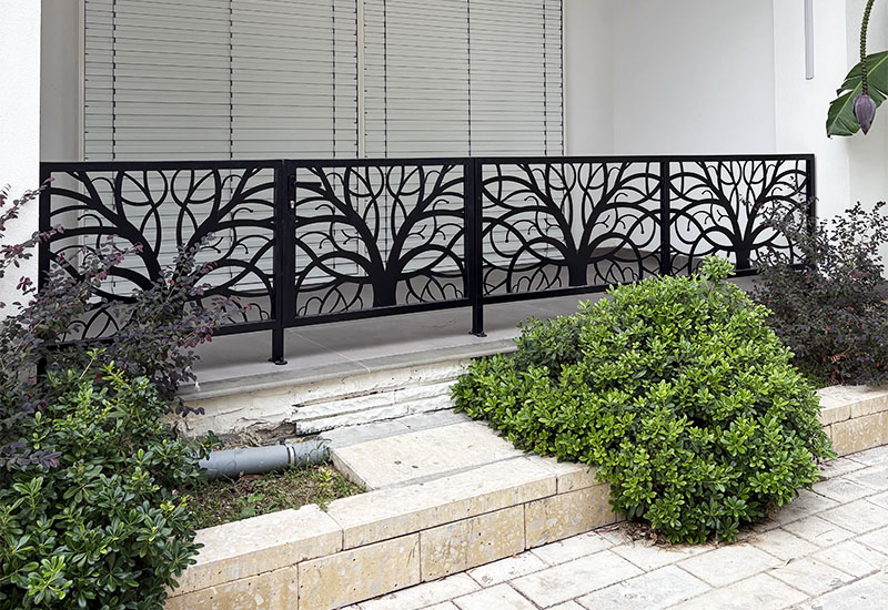 Contemporary Outdoor Fence with Decorative Branch Pattern
